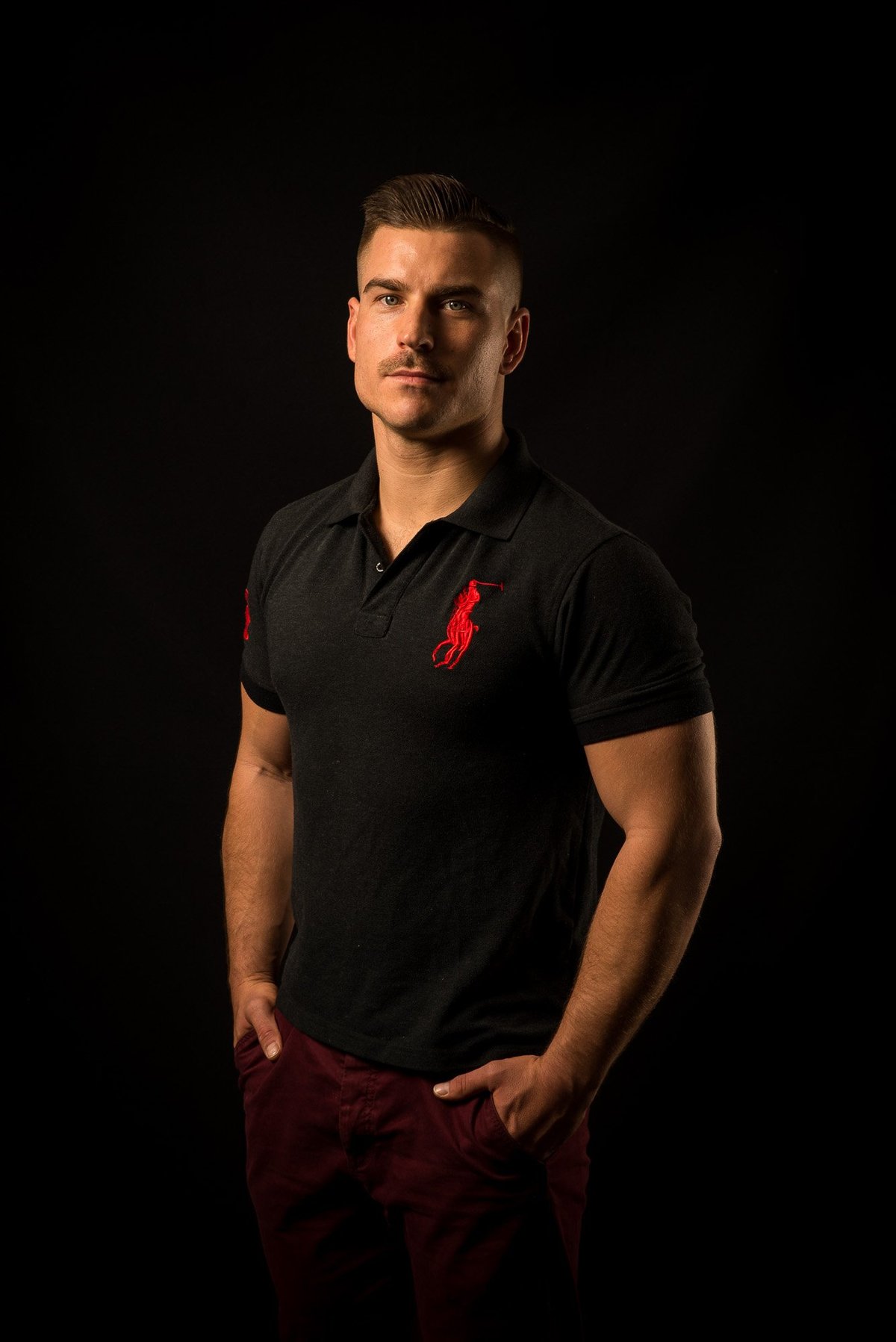 Coach Phill Terp — professional portrait in a black polo shirt, ready to work with you one-on-one